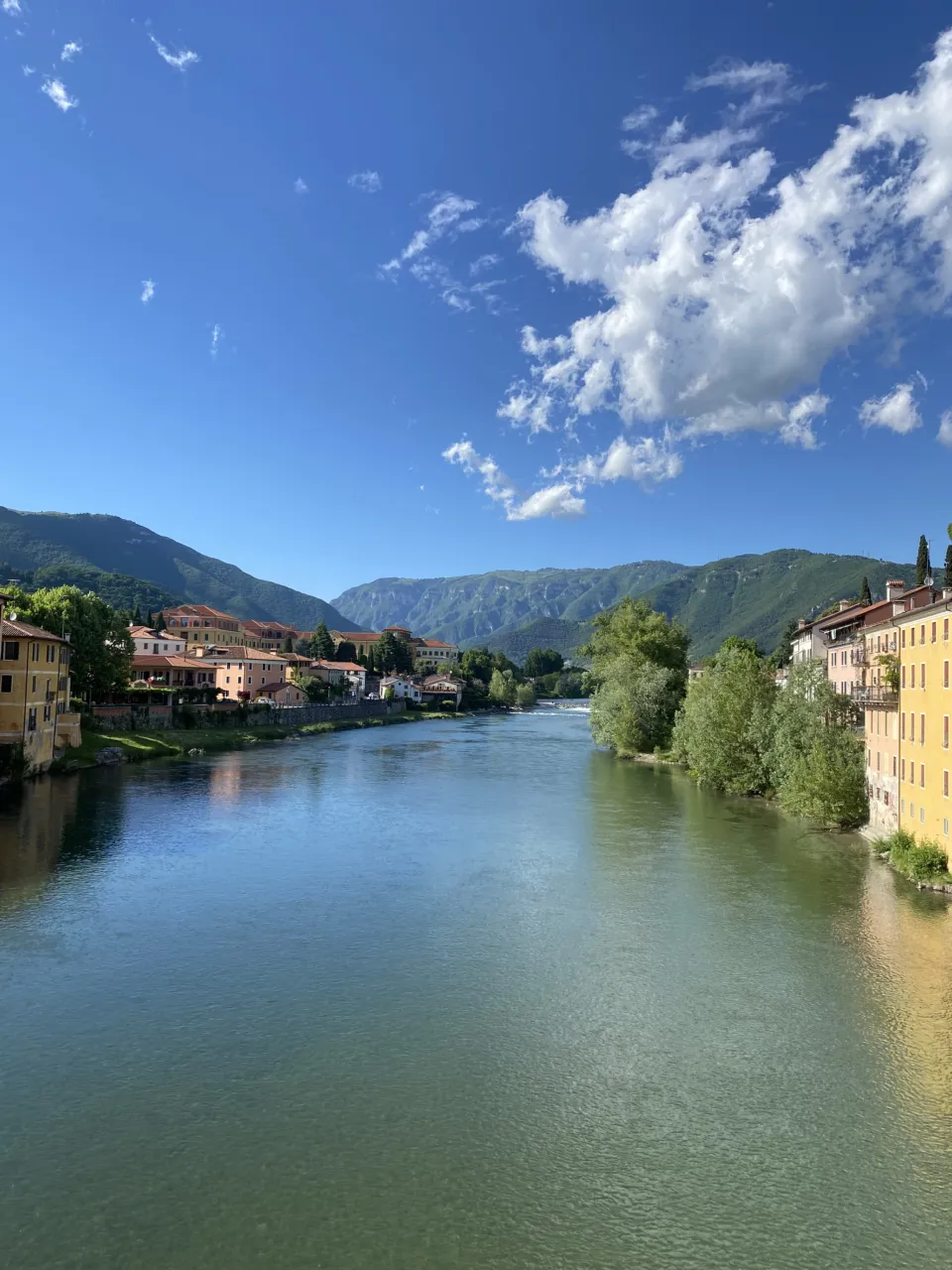 The Brenta river flowing through Bassano del Grappa towards the mountains