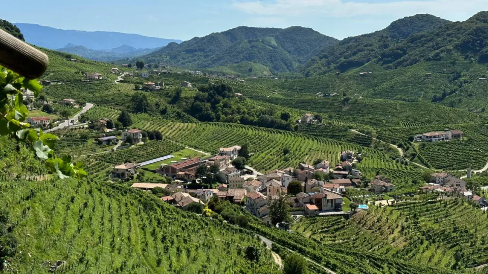 Hillside village surrounded by steep Prosecco vineyards