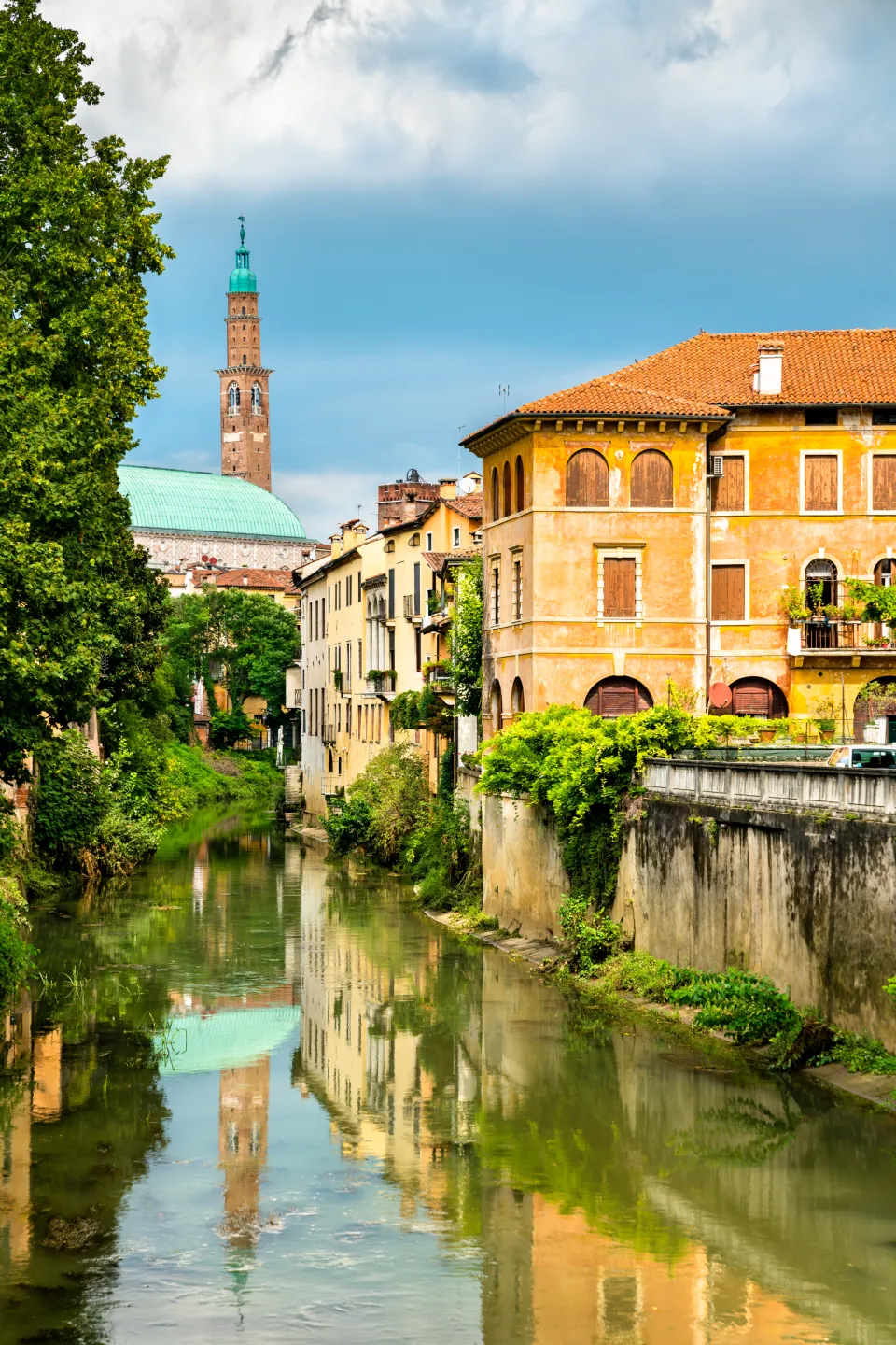 Torre Bissara and the Basilica Palladiana reflected in the Retrone river, Vicenza
